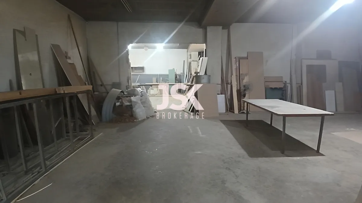 Warehouse for sale in Nahr El Mot